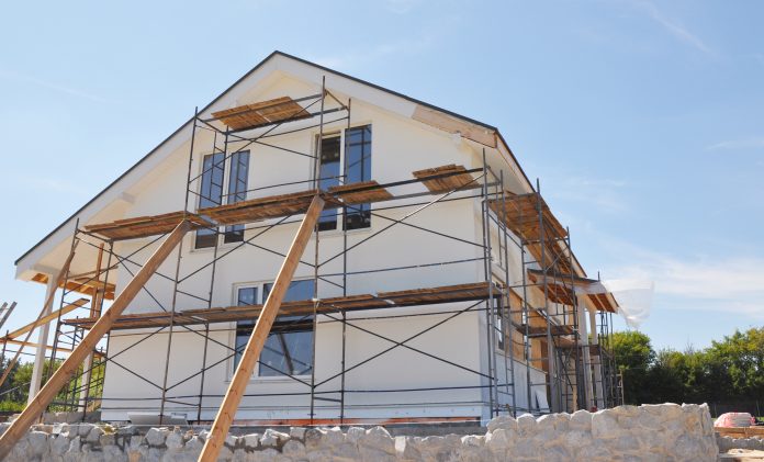 Exterior renovation of the house by rendering, insulating, plast